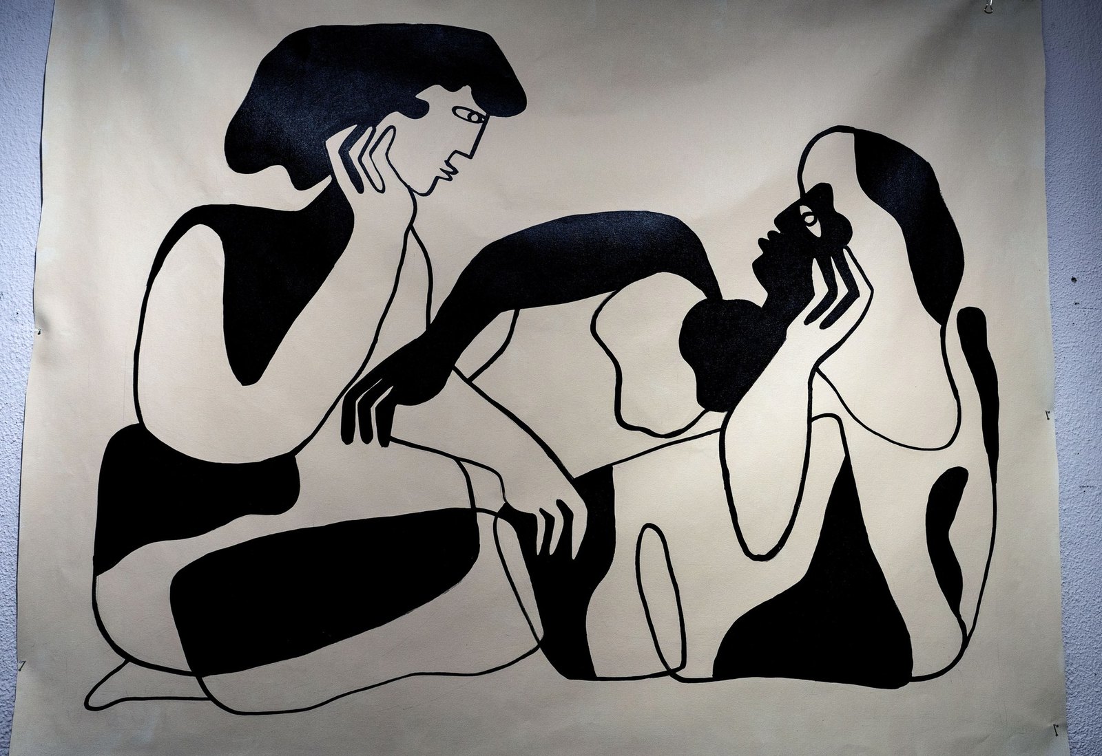 A wide painting of reclining black figures on a pale ground.