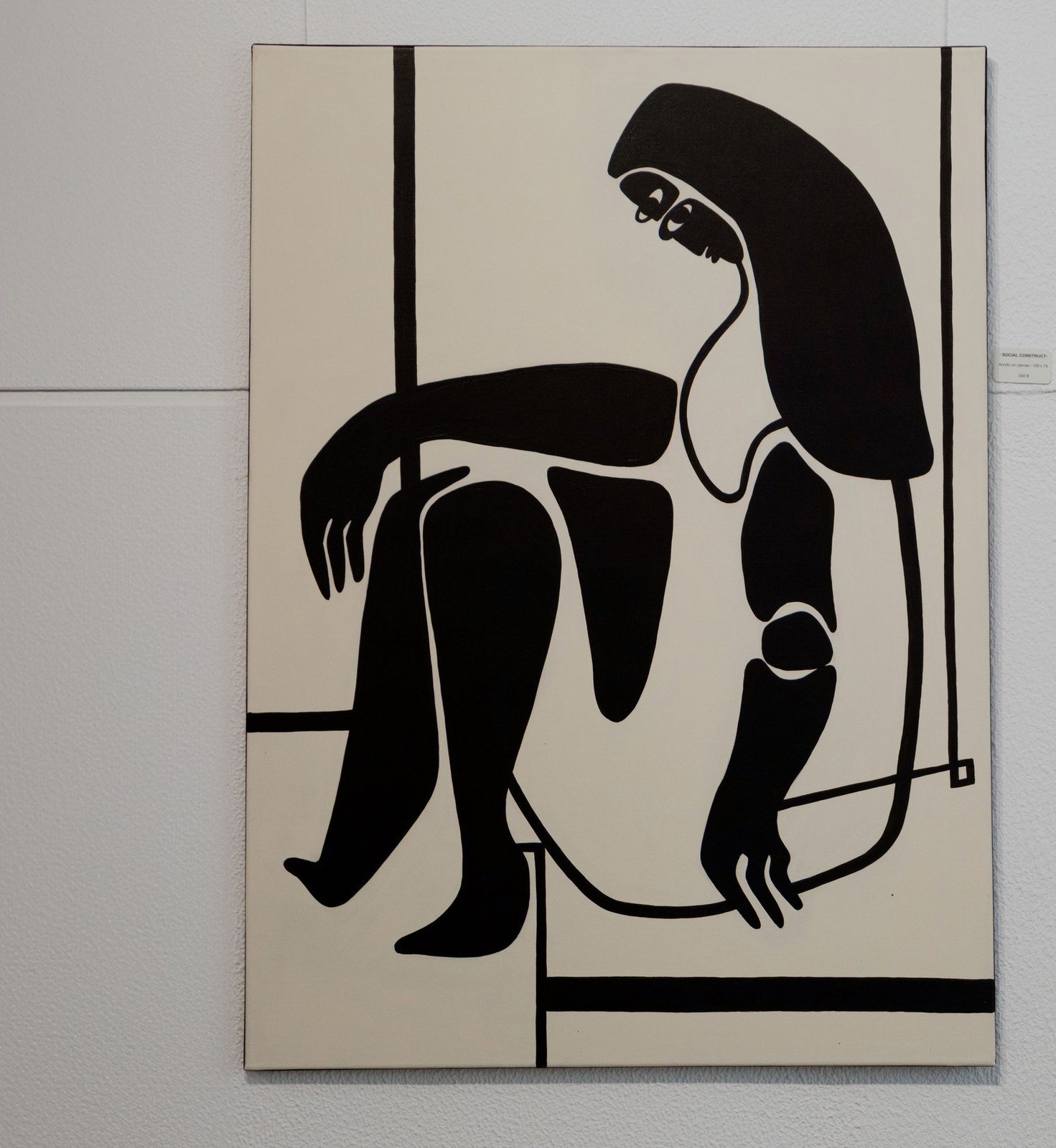 Control: a seated black figure held inside straight lines.