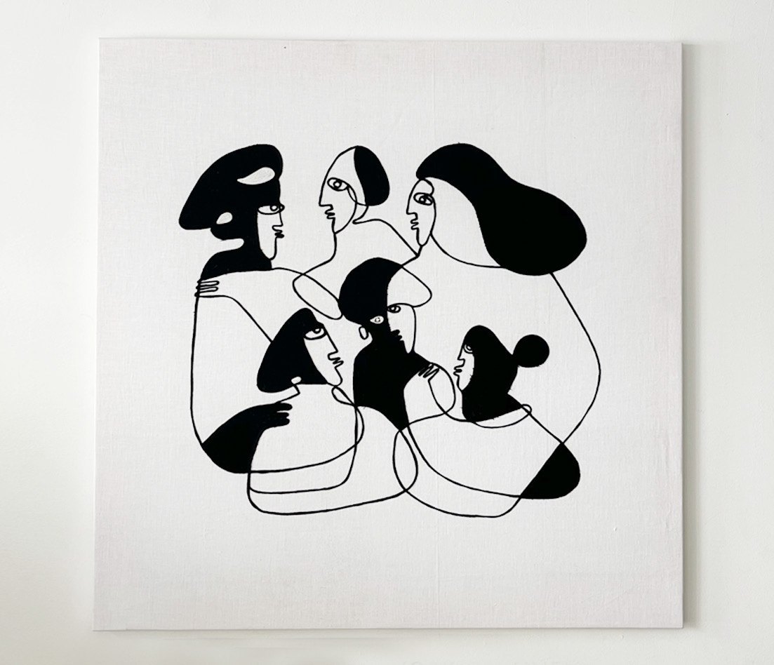 Community: embroidered figures on white cloth.