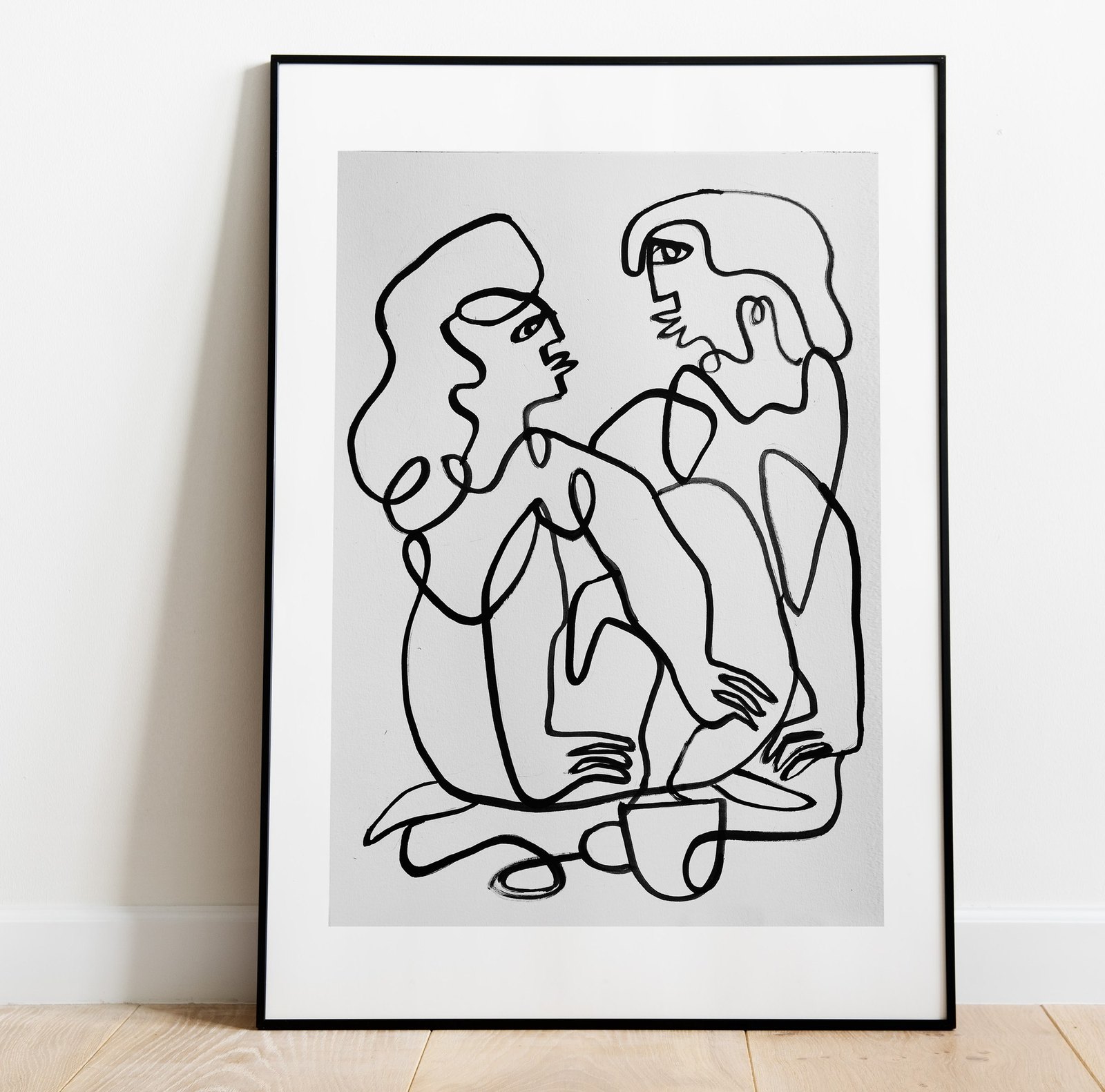 Conversation, framed and leaning against a wall.