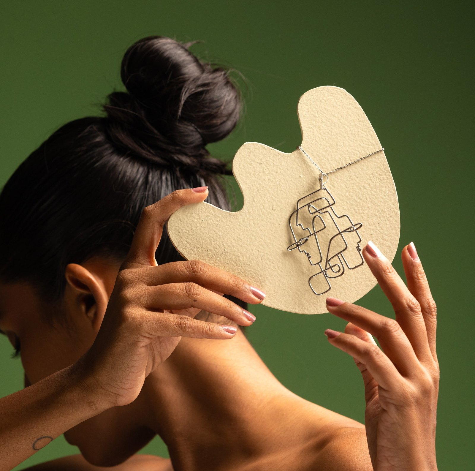 Perception: a brass piece held against the face.