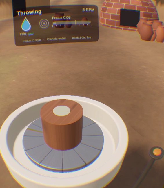 A clay cylinder on the spinning wheel.